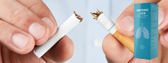 руки мужчины разламывают сигарету